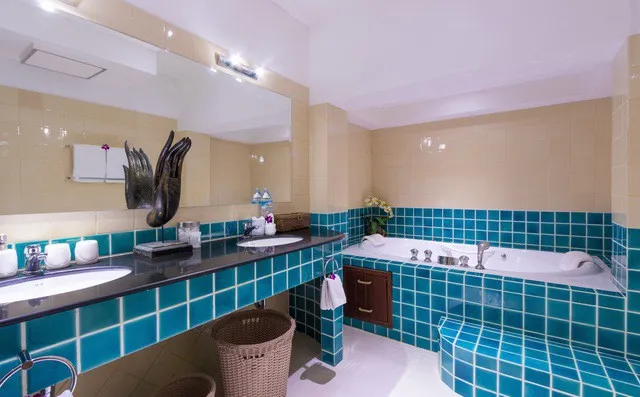 One of our luxury bathrooms with twin basins and bathtub jacuzzi